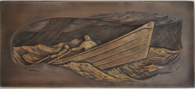 Photo of a bronze casting of a bas-relief carving of a man rowing a wooden dory in a heavy following sea in a rainstorm.